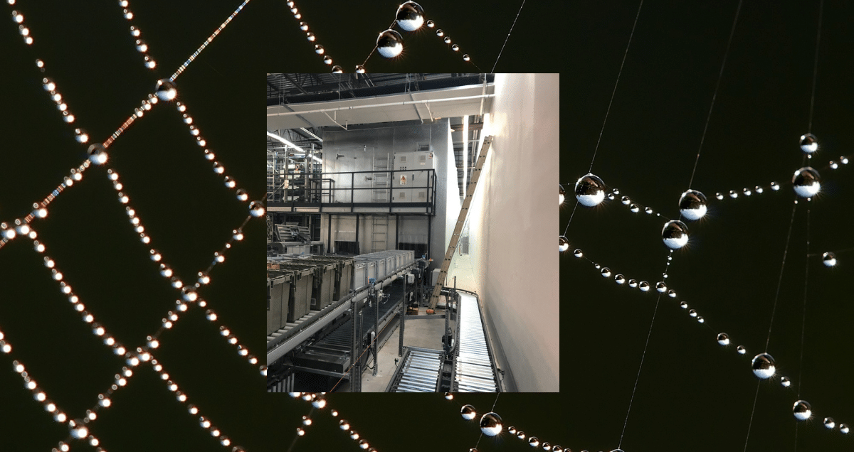 Walk-in cooler with robotics in a spider web with condensation