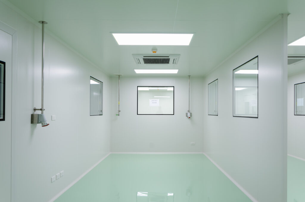An empty scientific clean room designed for controlled environments featuring IMPs for sterile environments.