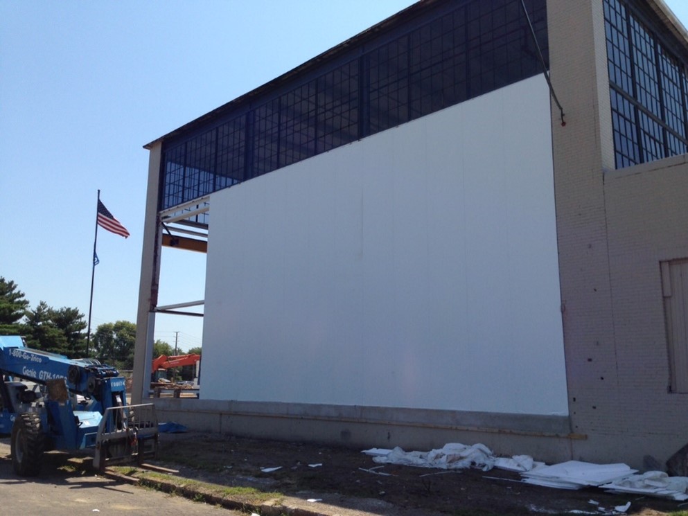Exterior warehouse being constructed of large insulated metal panels